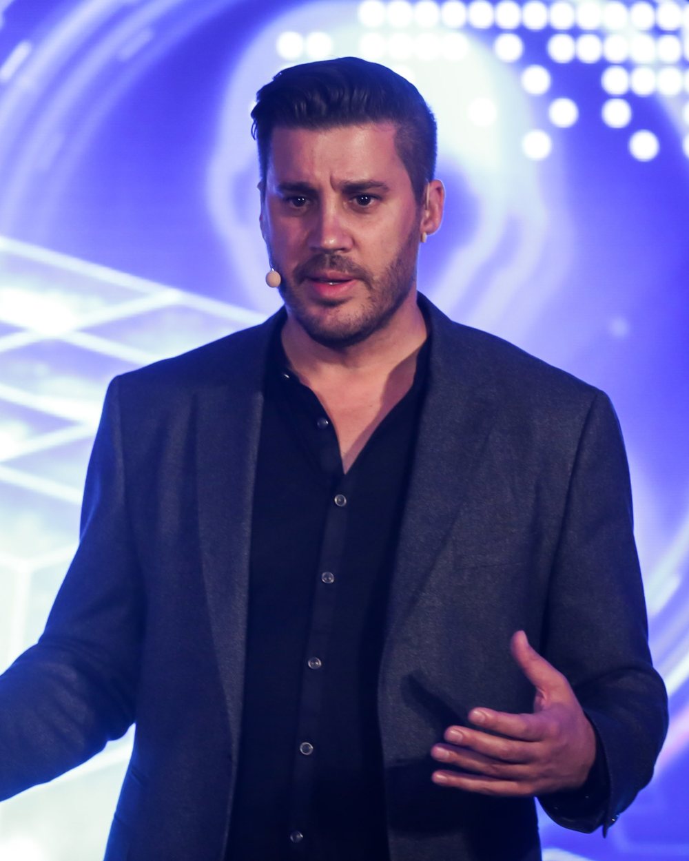 Ben Moorsom speaking on stage